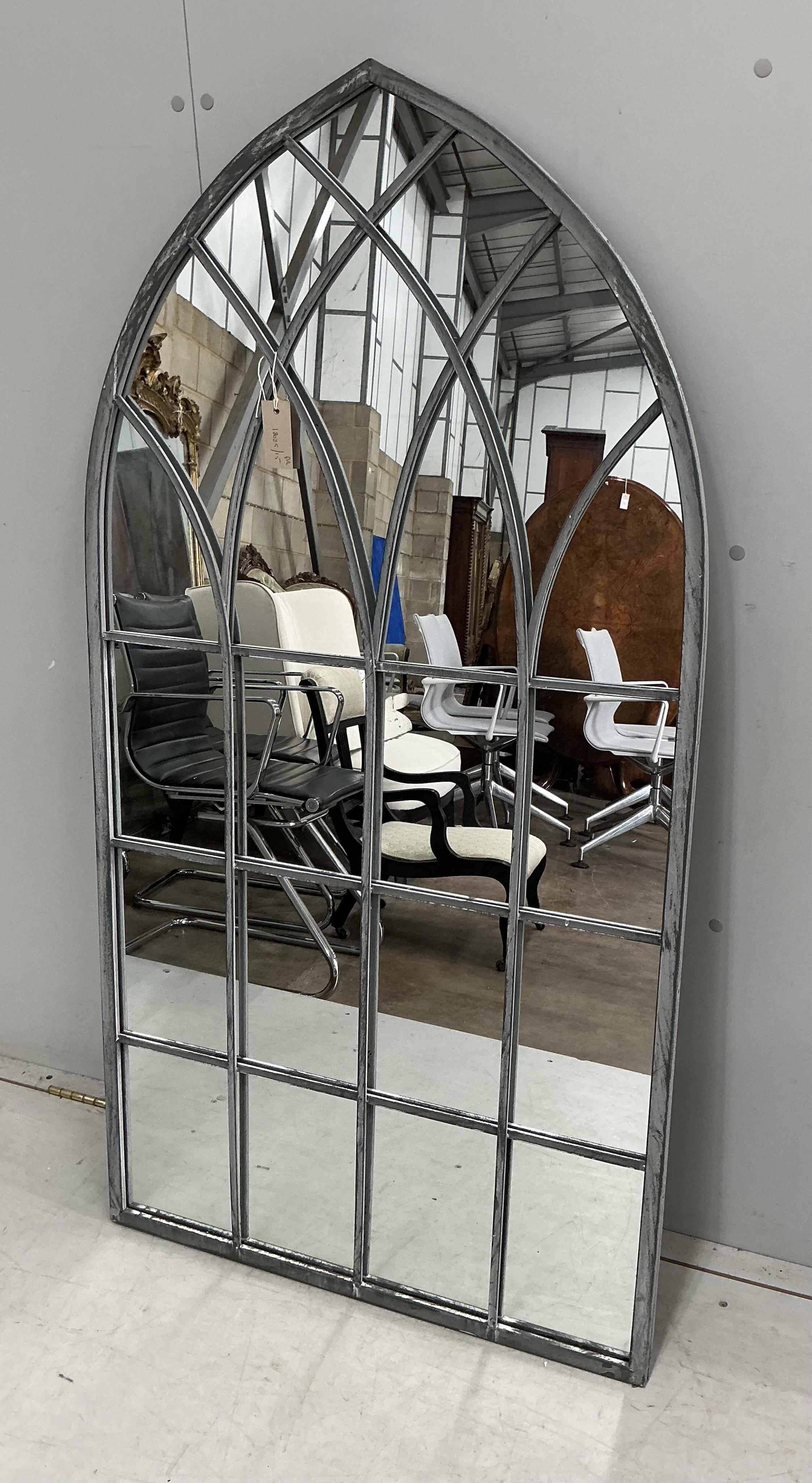 A pair of modern Gothic style arched window frame style wall mirrors, width 71cm, height 138cm